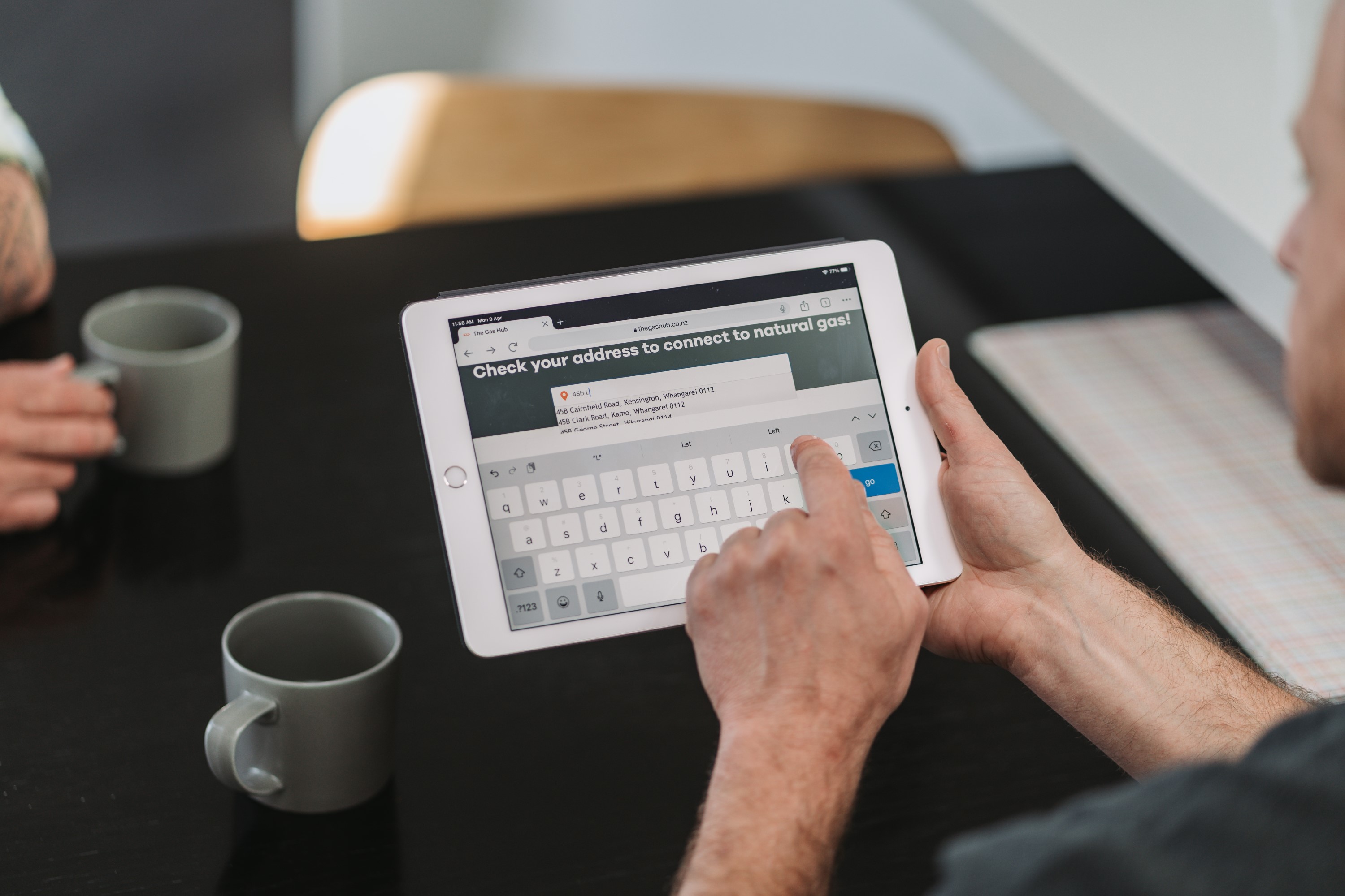 gasfitter using tablet with a customer